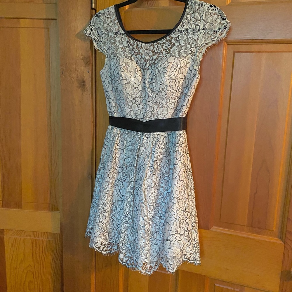 Elegant Lace Dress with Black Accents